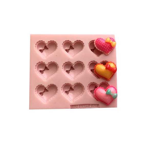 https://ohsweetart.com/wp-content/uploads/2021/01/mini-hearts-with-bow-silicone-mold.jpg